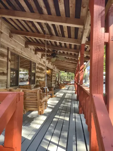 Front porch with rocking chairs and string lights